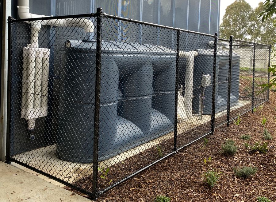 Chainwire storage cage for commercial rain tank